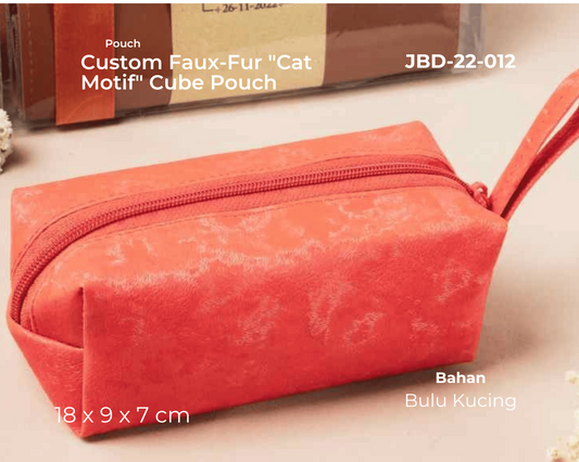 Red faux-fur cube pouch with 'cat motif' on a beige background