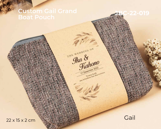 Custom gail grand boat pouch with personalized text on a beige background
